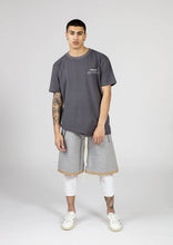 Load image into Gallery viewer, White Male model wears mens grey casual summer fashion long shorts silk lined for our menswear blog and magazine photography